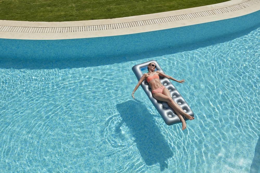 Elissa Adults-Only Lifestyle Beach Resort Kallithea  Luaran gambar A woman on a pool float